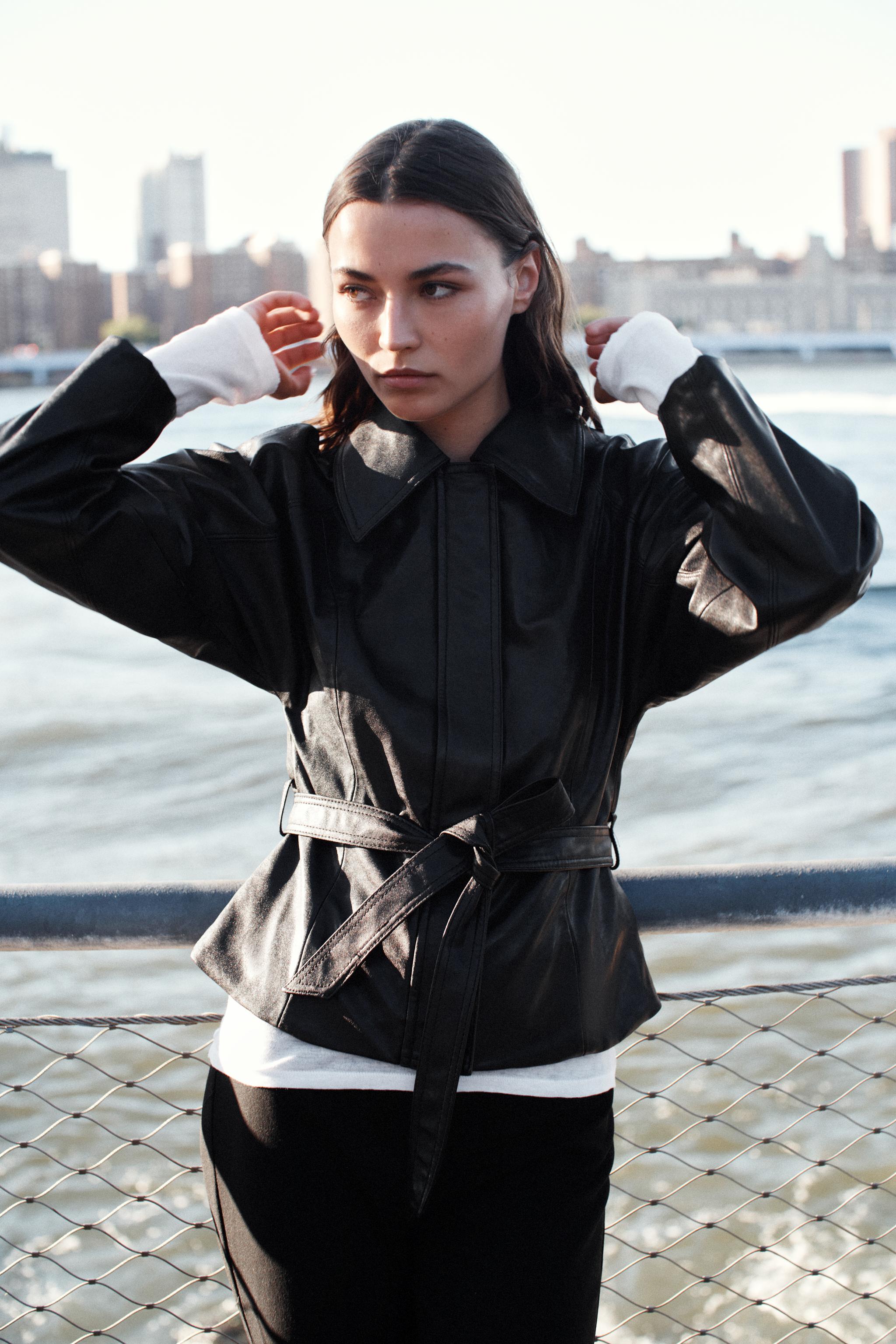 LEATHER-EFFECT BELTED JACKET
